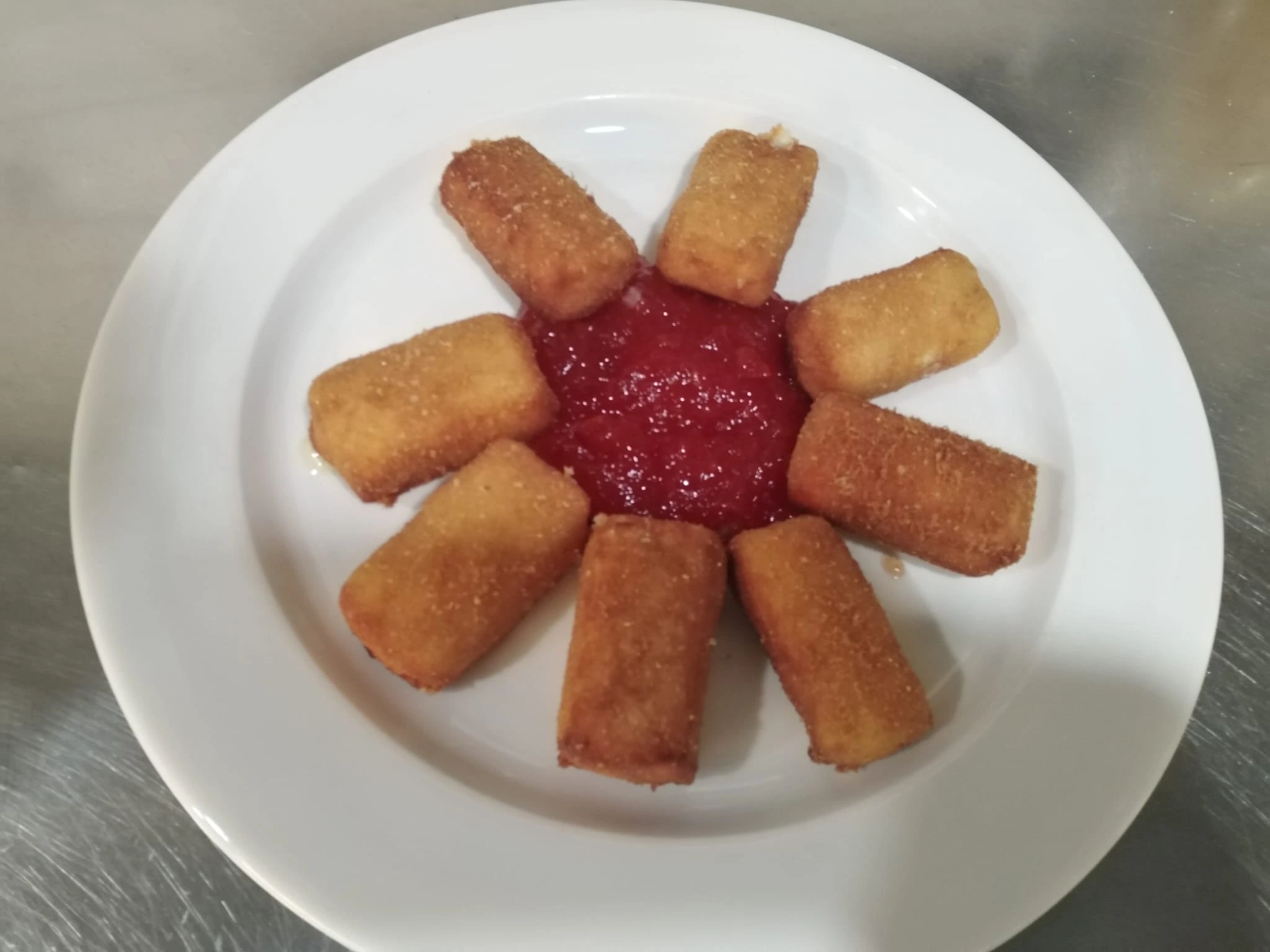 Queso brie con confitura de tomate